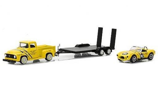 Diecast model cars Ford F-100 Pickup 00 yellow 1954 with Coventry Moteurs 289 Cobra and Flatbed Trailer 1/64 Greenlight