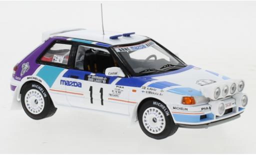 Diecast model cars Mazda 323 GTX No.11 Rally Team Europe 1000 Lakes Rally 1990 with night lights H.Mikkola/A.Hertz 1/43 IXO