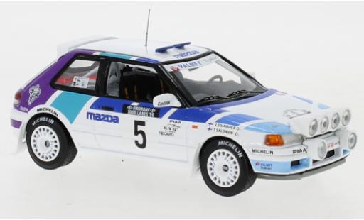 Diecast model cars Mazda 323 GTX No.5 Rally Team Europe 1000 Lakes Rally 1990 with night lights T.Salonen/V.Silander 1/43 IXO